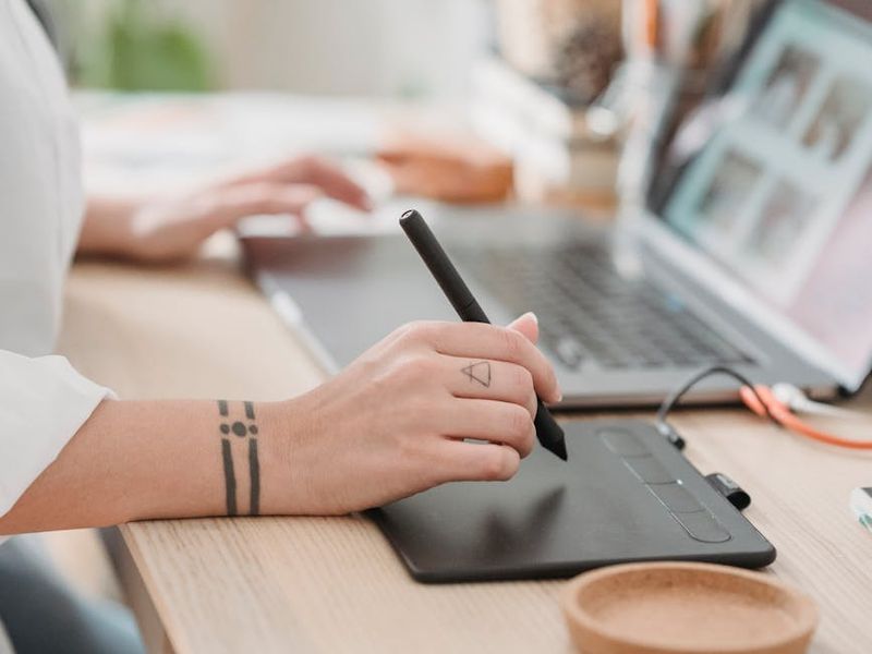Person working at a clean desk looking into the distance